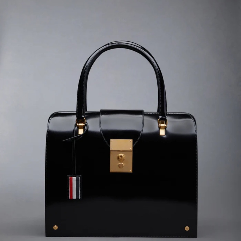 Never worn authentic Thom Browne Elegant Black Handbag with Gold Accents